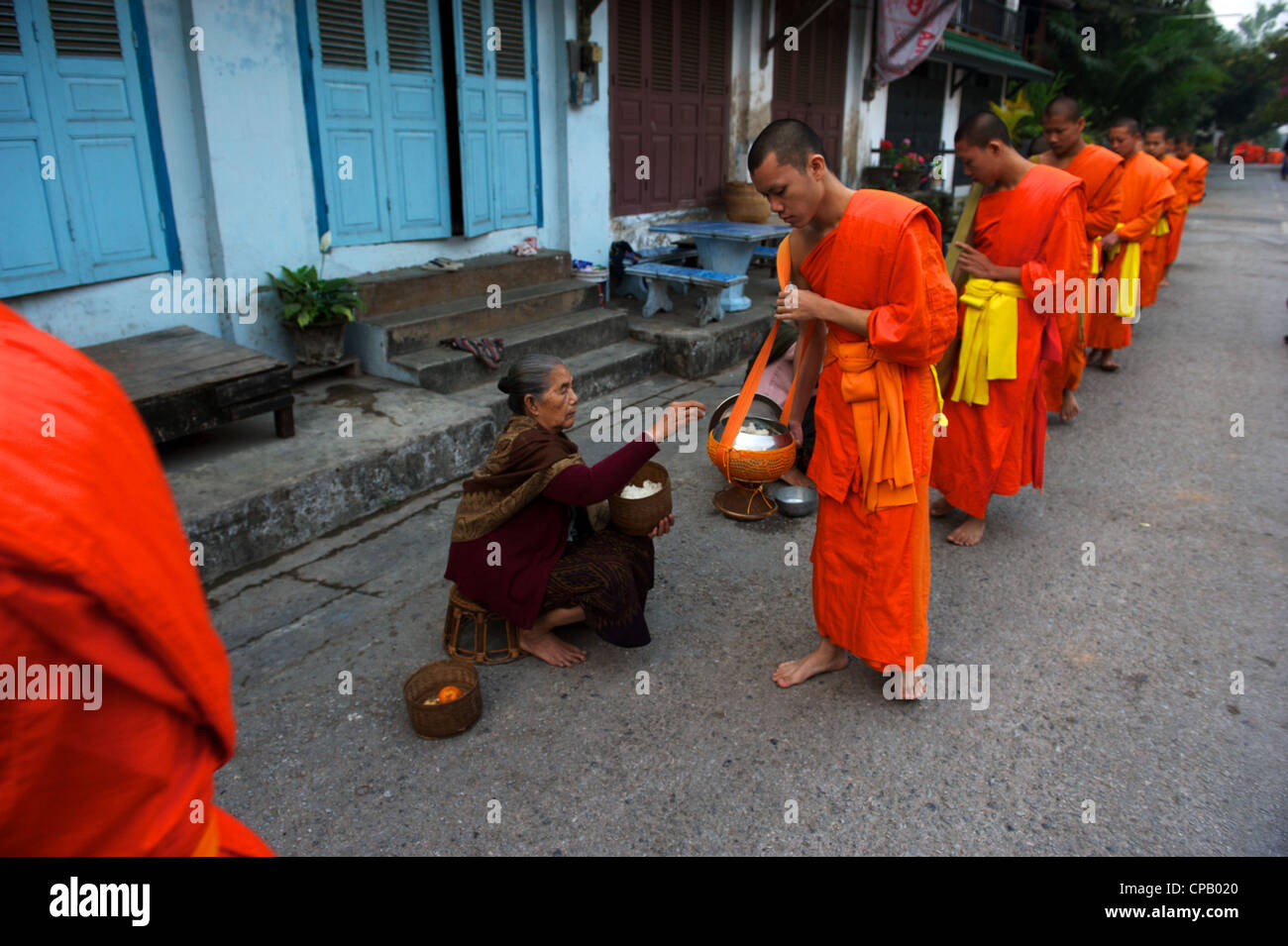 Monks collect alms every morning at dawn, Luang Prabang, Mekong River, Laos Stock Photo