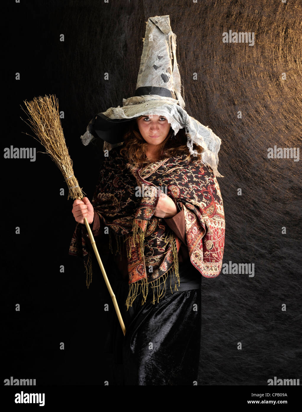 witch with broom on structured dark background Stock Photo - Alamy