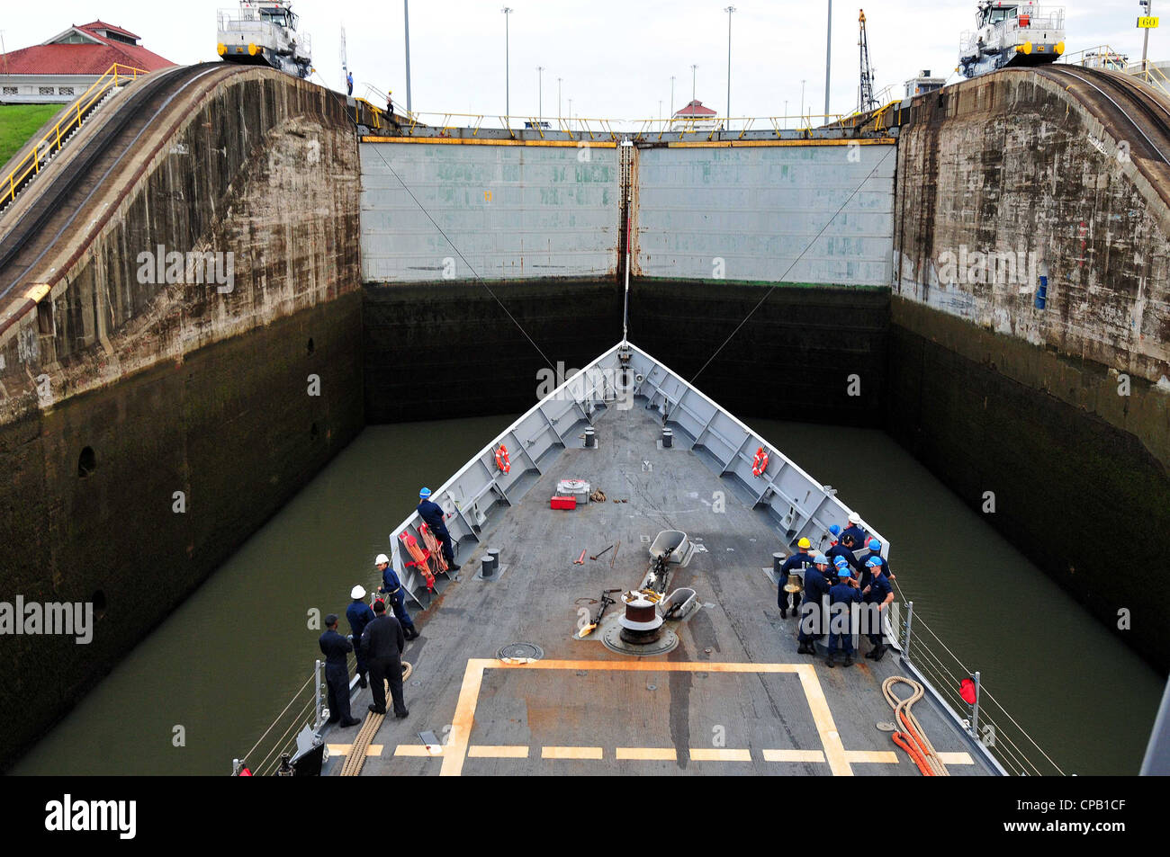 The Gatun Locks fill with water to raise the Oliver Hazard Perry-class guided-missile frigate USS Underwood (FFG 36) during its transit of the Panama Canal. Underwood is deployed to Central, South America and the Caribbean in support of Southern Seas 2012. Stock Photo