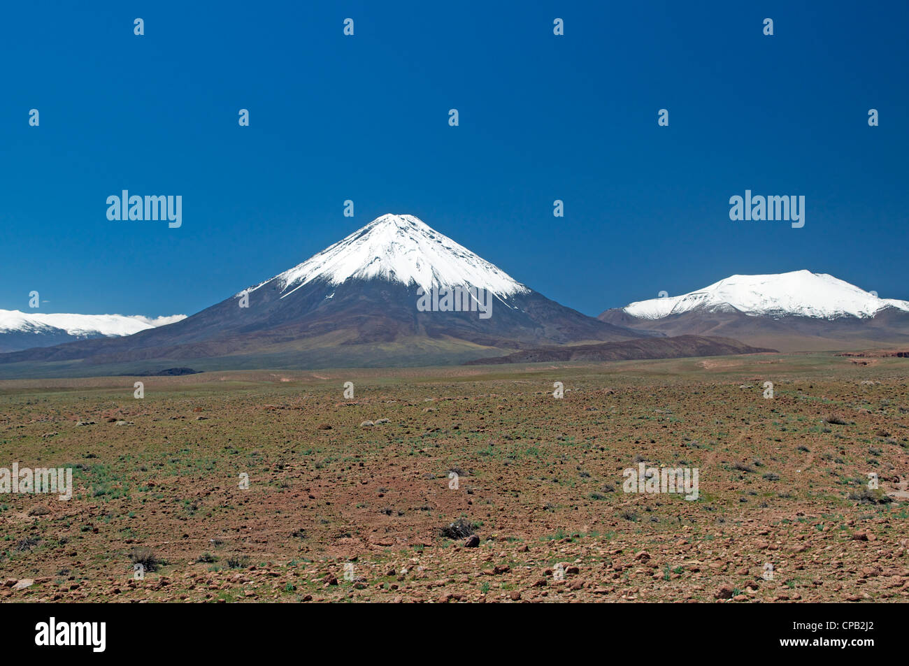 Volcan Licancabur and snowcapped mountains near San Pedro de Atacama Chile Stock Photo