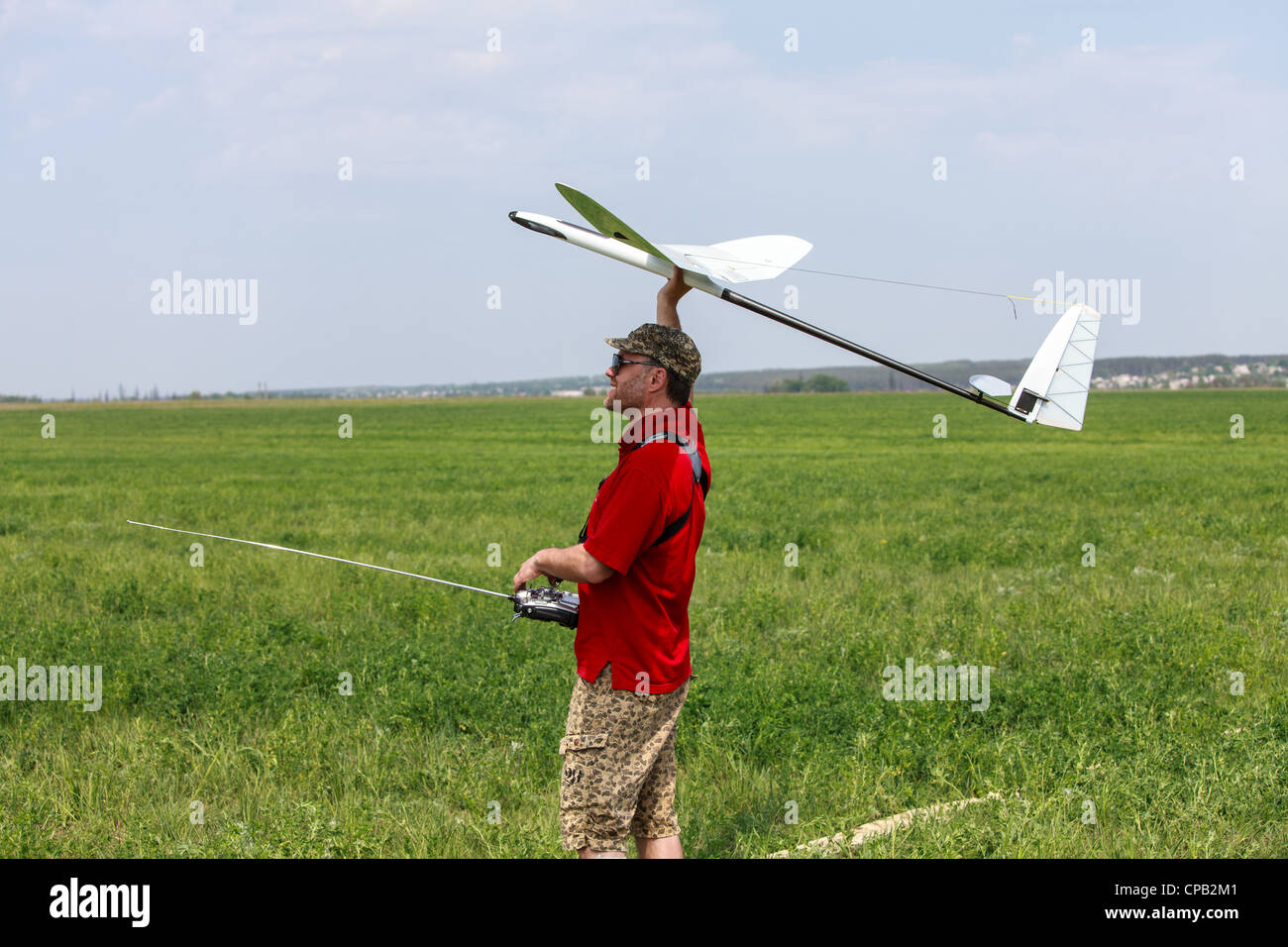 Man launches into the blue sky RC glider Stock Photo Alamy