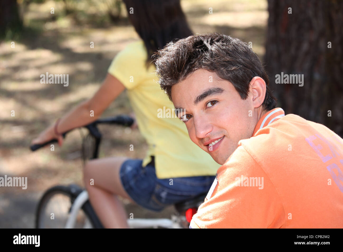 Teen couple on bike ride Stock Photo