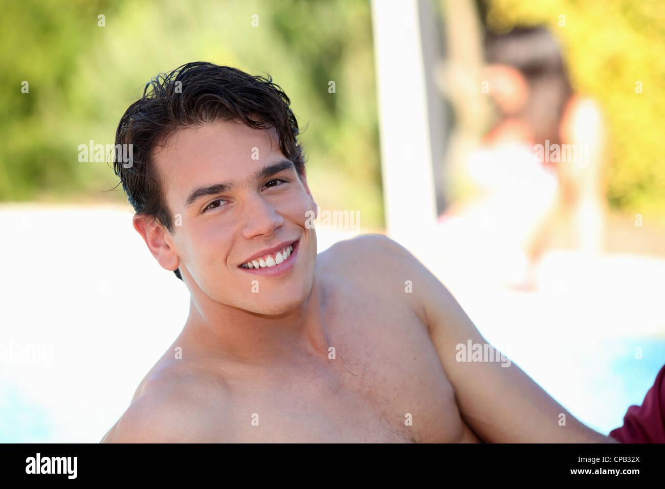 Man laid poolside Stock Photo - Alamy