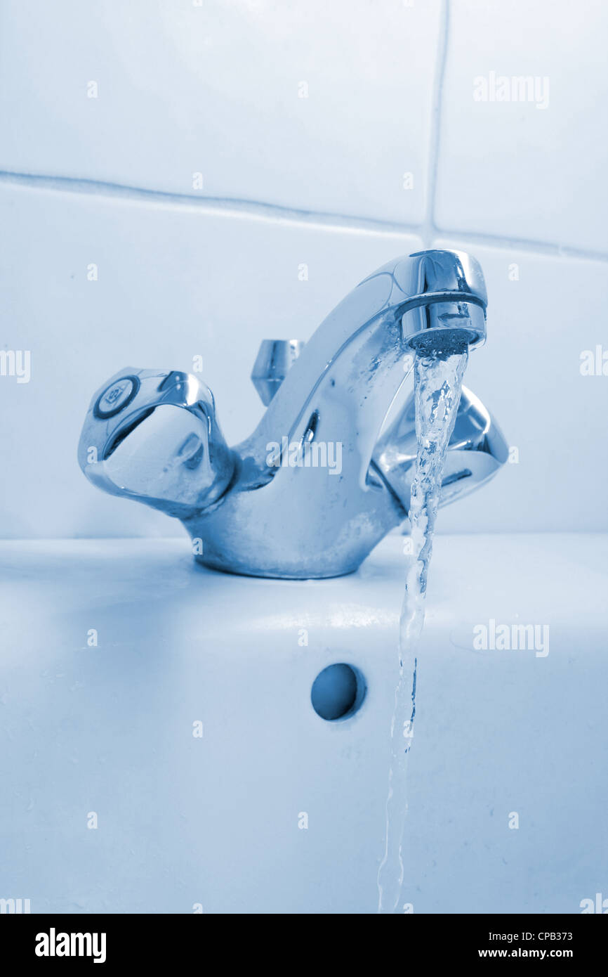 Running water from a faucet Stock Photo