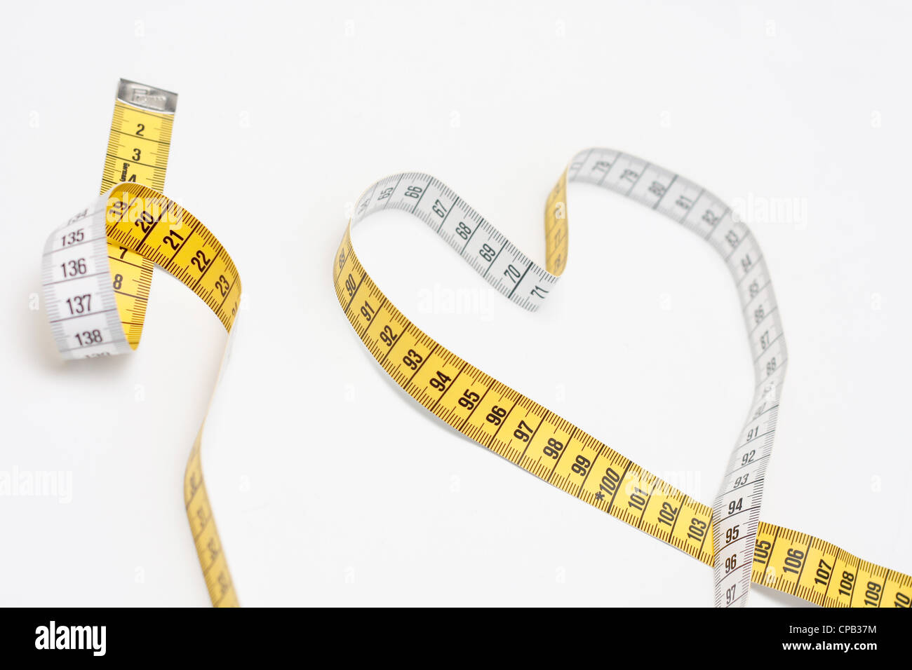 Tape measure creating a heart Stock Photo Alamy