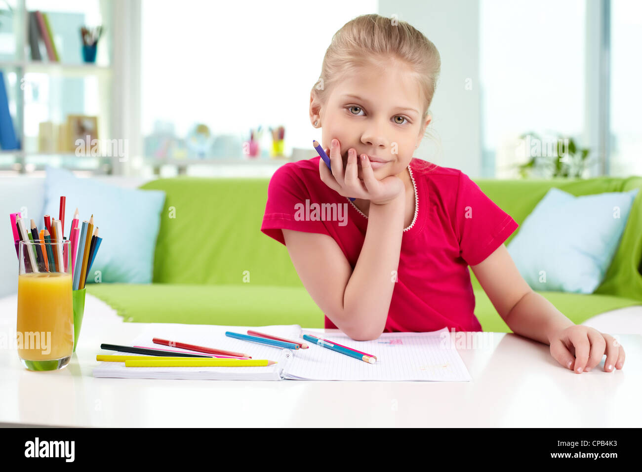 Portrait of lovely girl with colorful pencils looking at camera Stock ...
