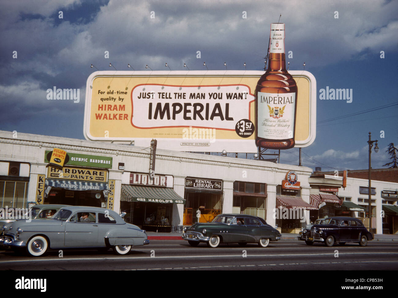 Whiskey billboard at Olympic and Crenshaw in Los Angeles circa 1951 Stock Photo