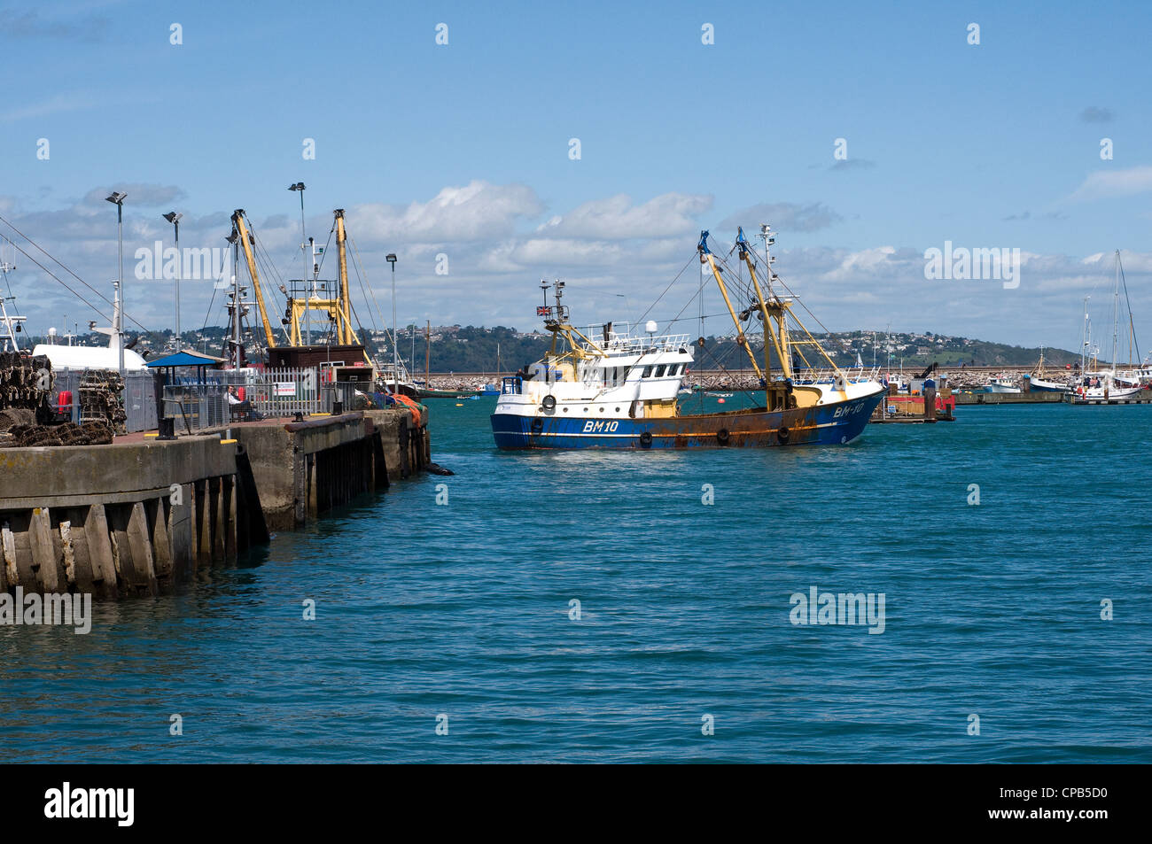 Brixham Harbour,Trawler Fleet,Devon,at the seaside,storm brewing, abstract, background, bobber, buoy, catch, close-up, color, de Stock Photo