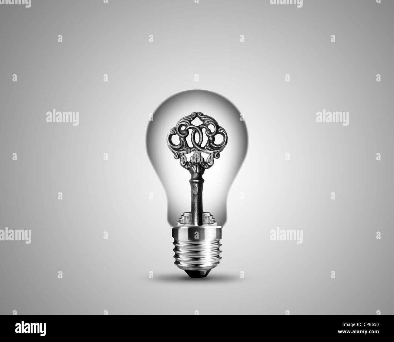 old key in light bulb, conceptual image for solutions Stock Photo Alamy