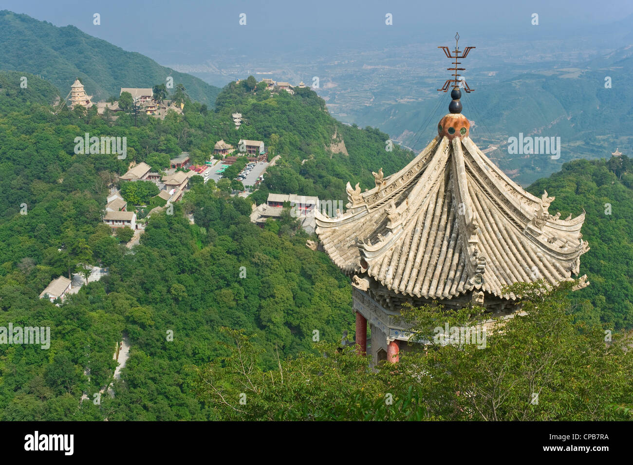 View from thunderclap peak on Mount Kongtong with Three Religions Temple in the foreground looking towards the tourist Center. Stock Photo
