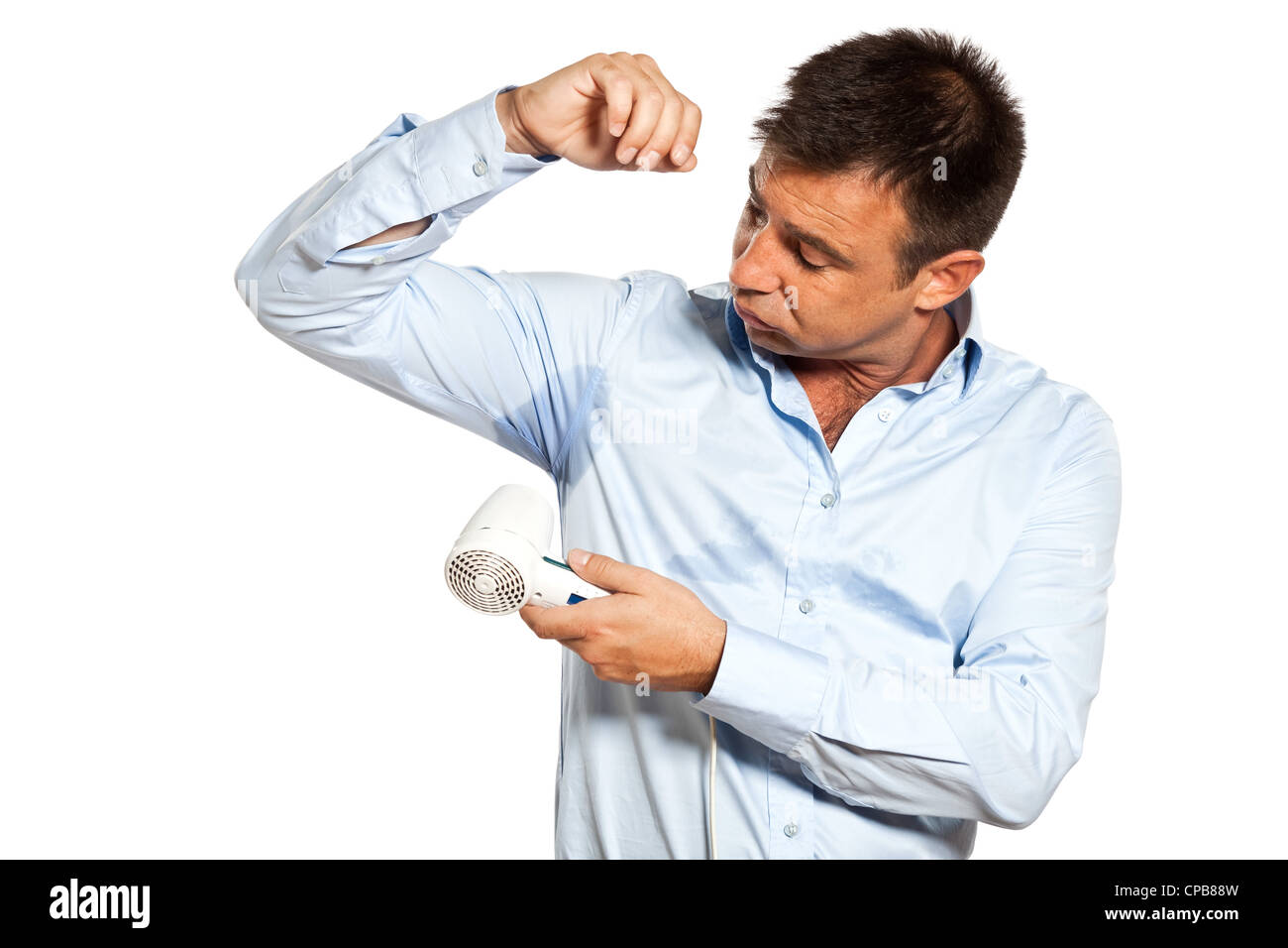 One Caucasian Man With Sweat Stain Perspire Drying Shirt With Hair Dryer In Studio Isolated On 