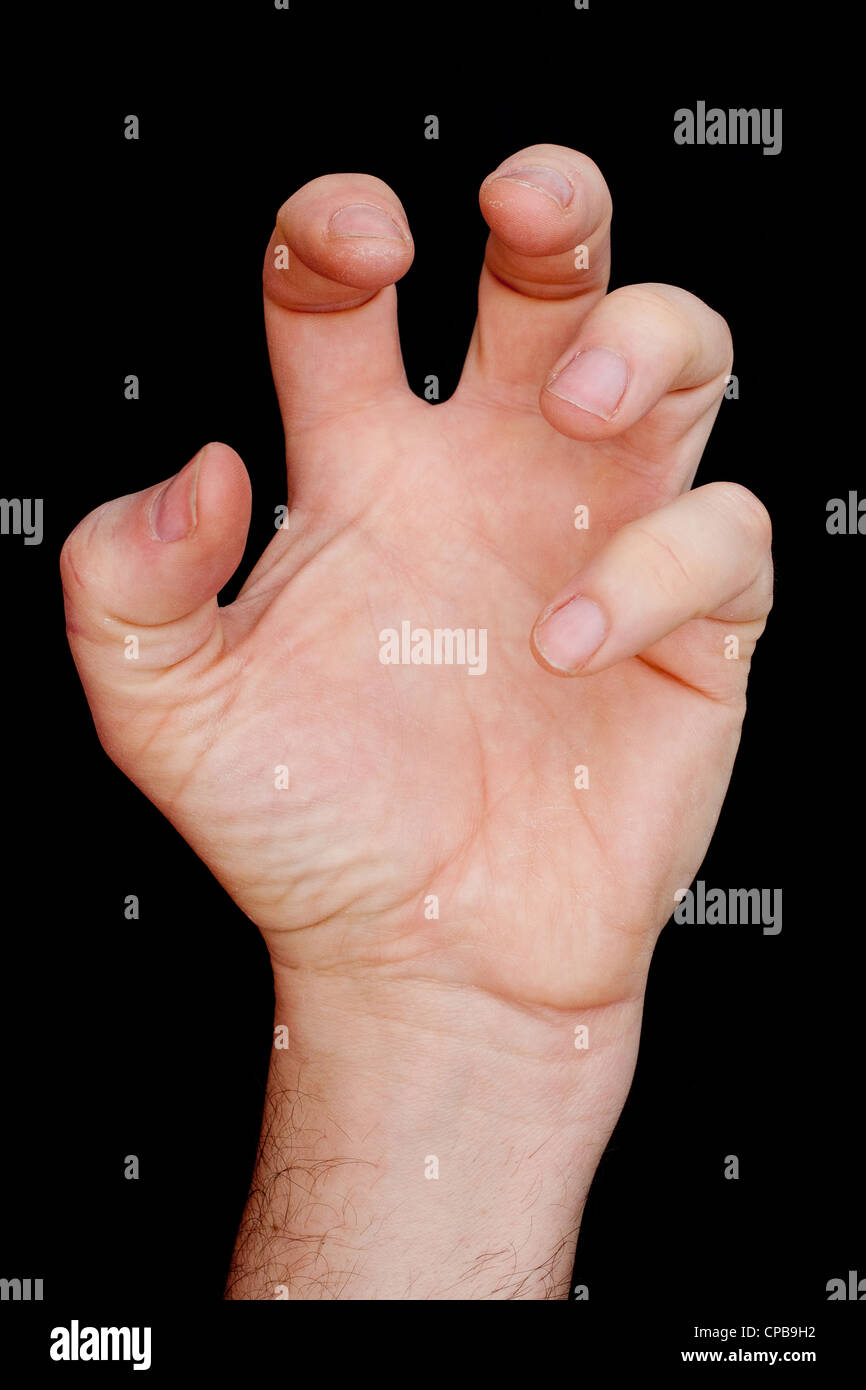 Clutching Hand On Black Background Stock Photo Alamy