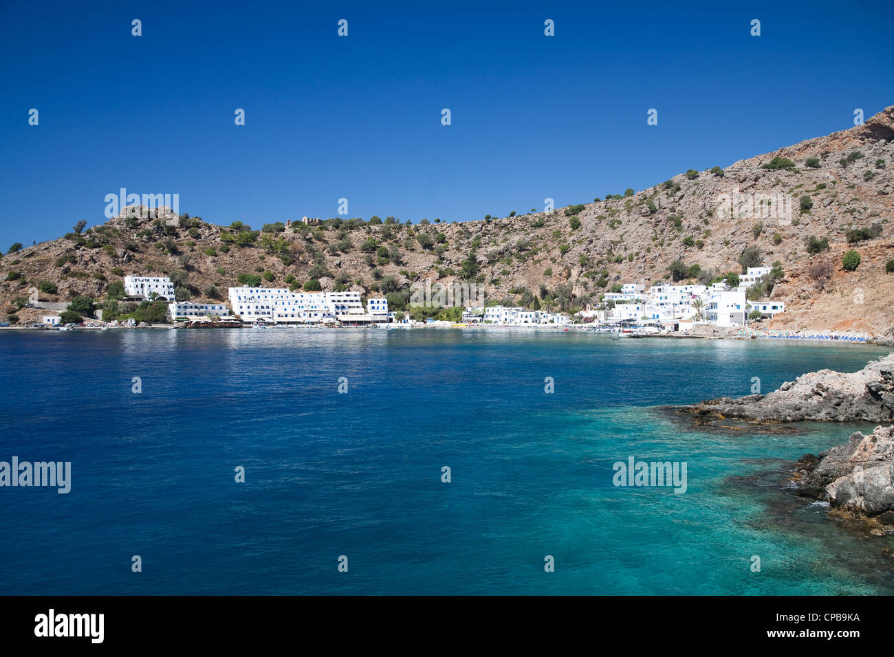 The sunbathed village of Loutro on the south coast of Crete, the village is only accessible by boat or foot. Stock Photo