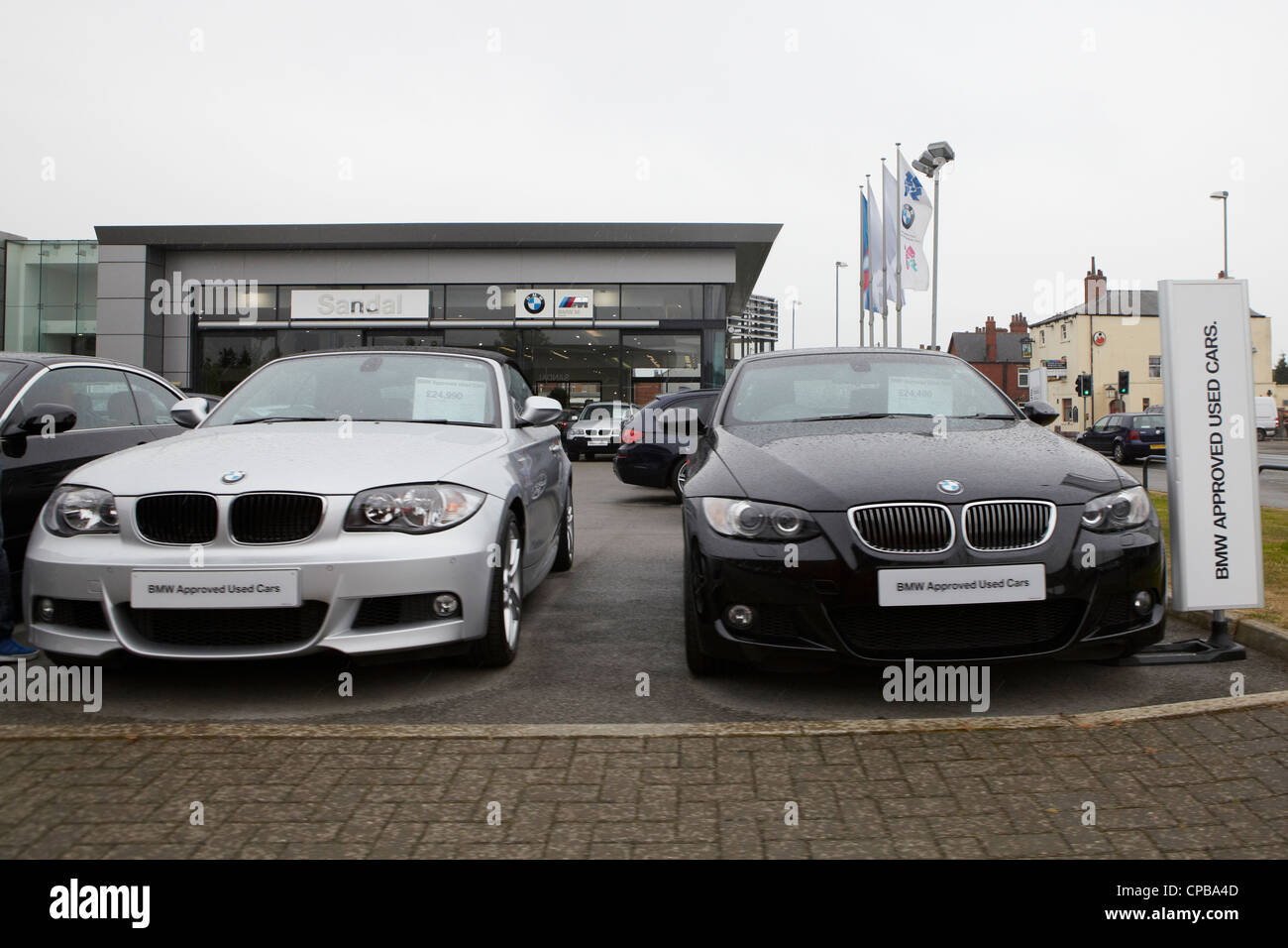 BMW cars on car dealer forecourt Stock Photo