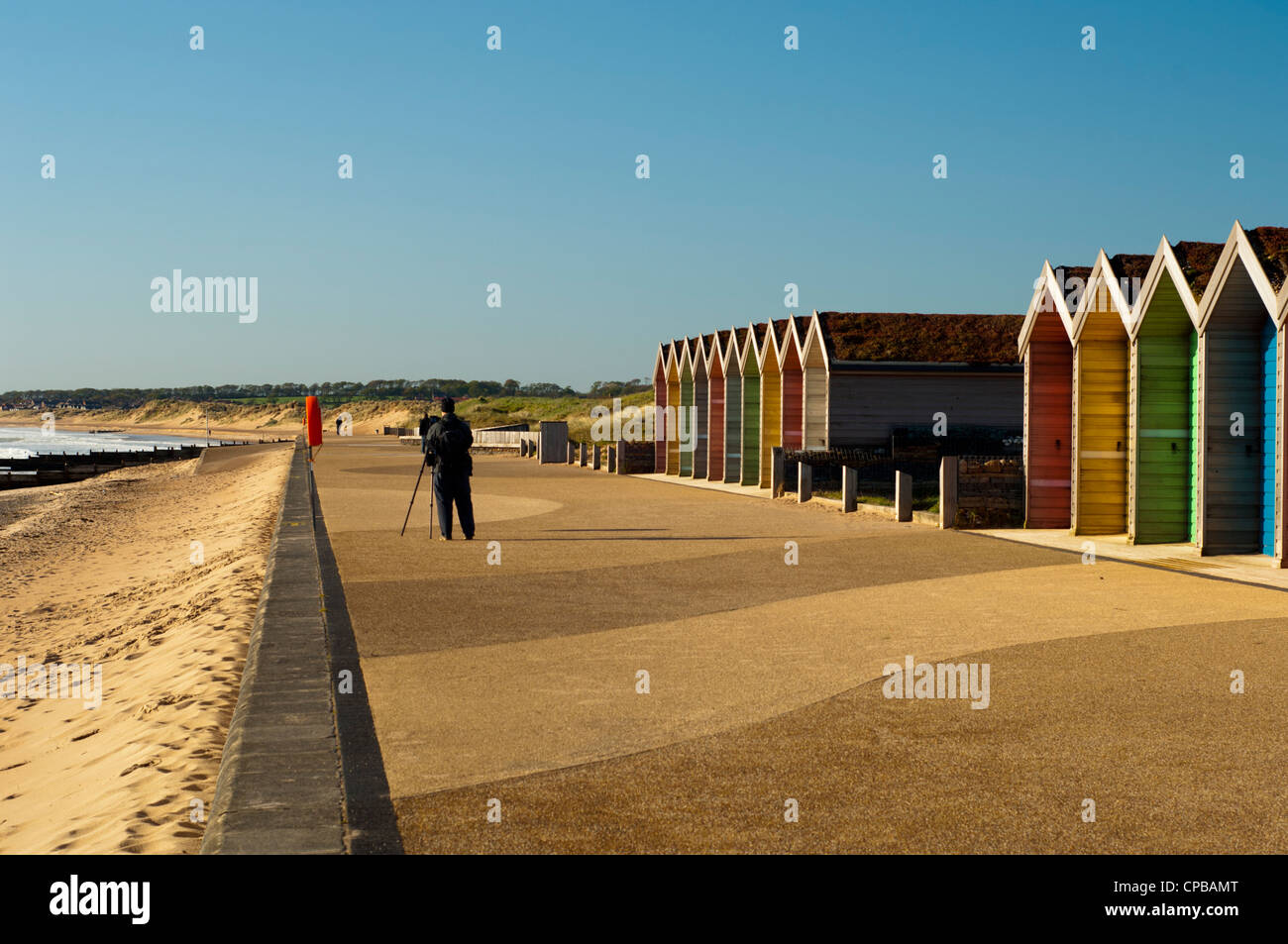 Beach huts and photographer Stock Photo