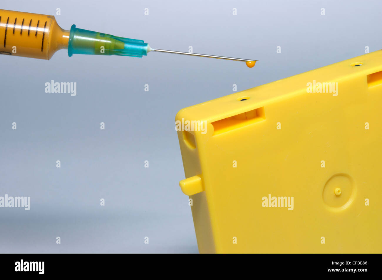 Ink filled syringe to fill ink cartridge Stock Photo - Alamy