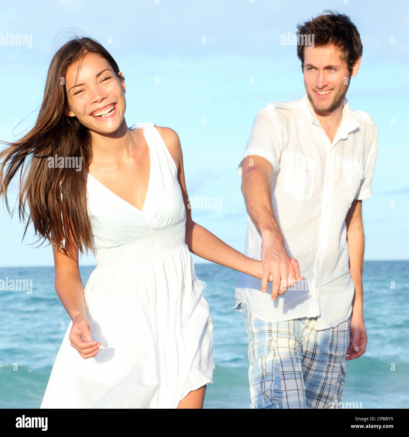 Happy Interracial Young Couple Asian Woman Caucasian Man Enjoying
