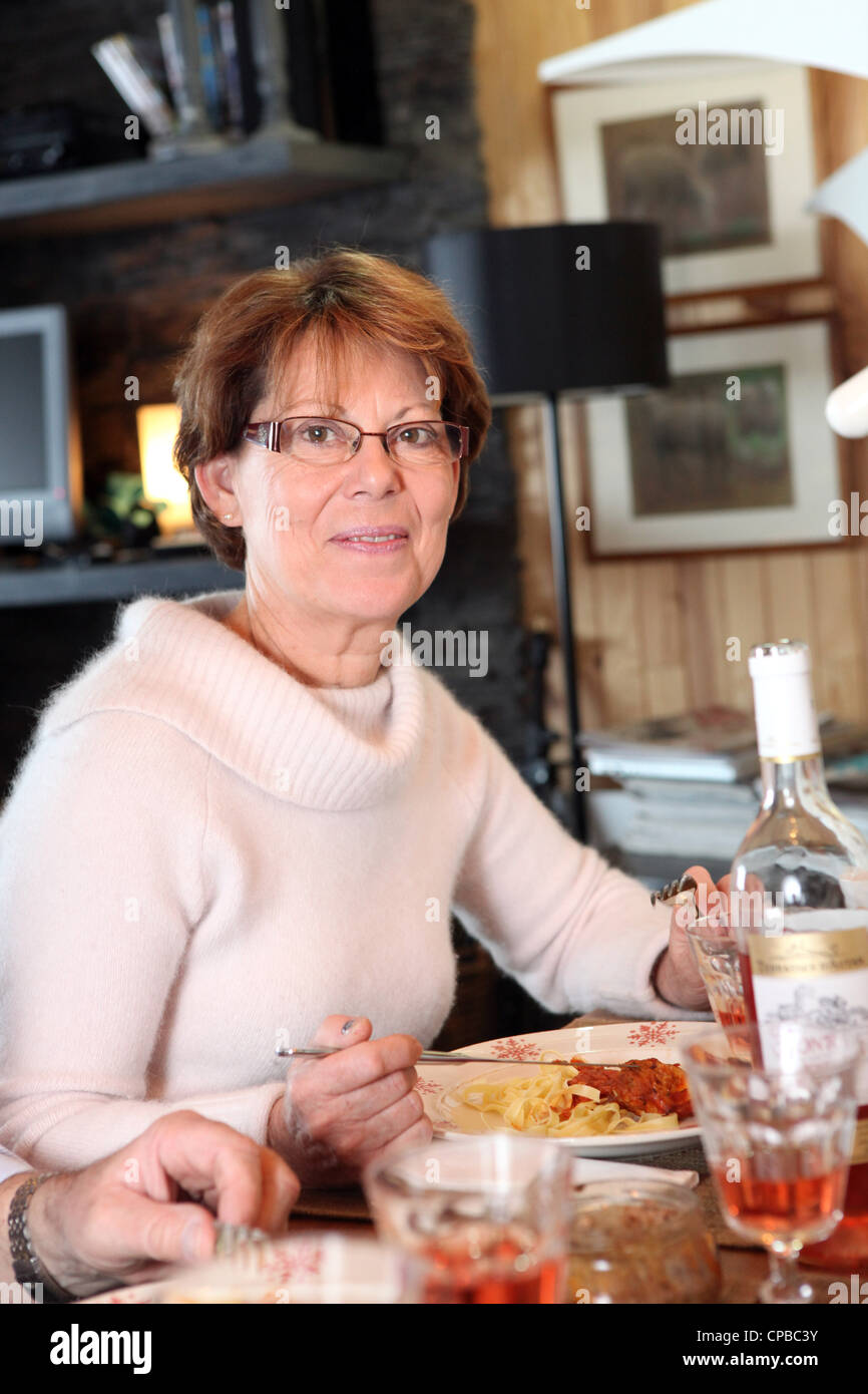 Woman eating pasta for dinner Stock Photo Alamy