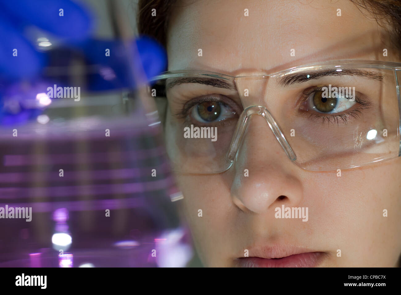 female scientist works in the laboratory performing chemical and biological tests Stock Photo