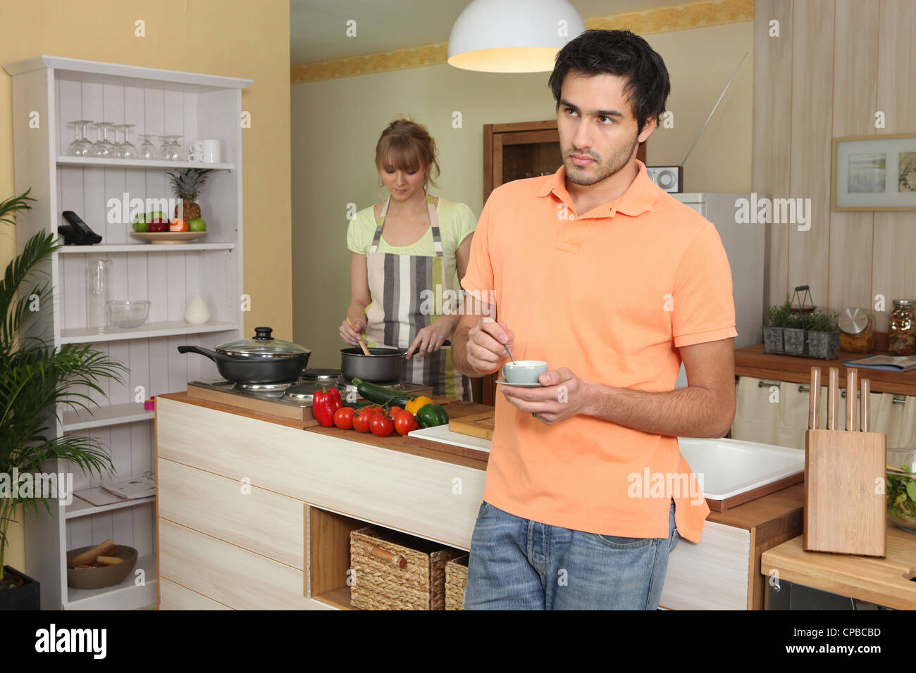 Couple in a kitchen Stock Photo