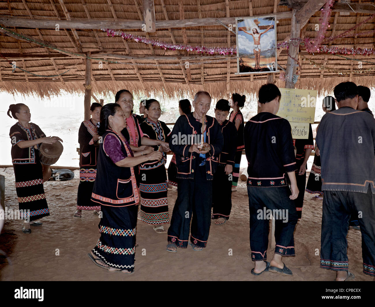 Lahu people of Thailand's Northern hilltribes. Christian in their believe and seen here worshiping Christ.  Chiang Rai province. Rural Thailand people Stock Photo