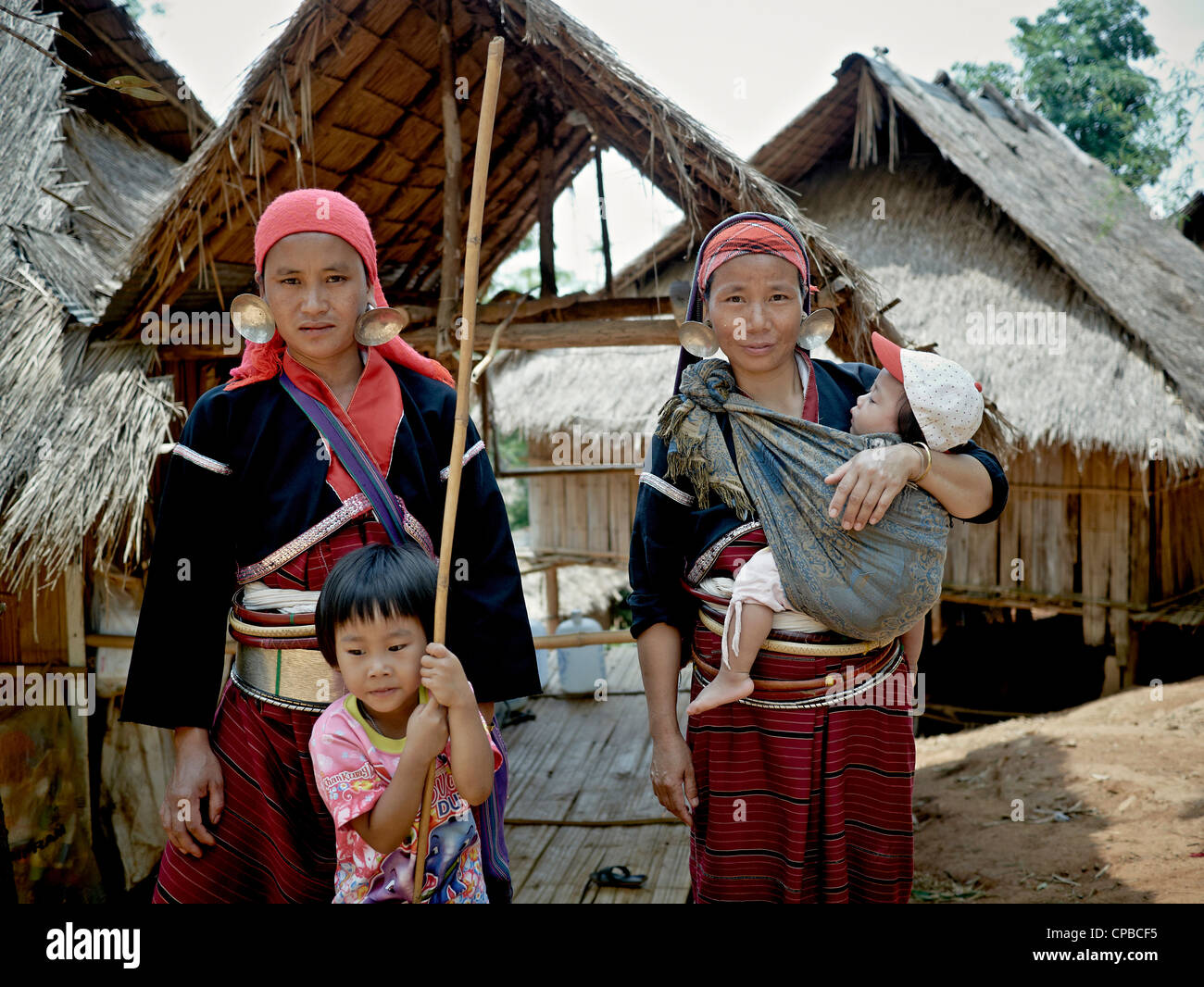 Palong (big earring) woman and children of Thailand's Northern hilltribes. Chiang Rai. Rural Thailand people S.E. Asia. Hill tribes Stock Photo