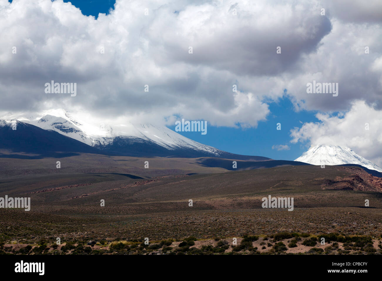 Lascar volcano surrounded by clouds, near Nacimient Gorge, San Pedro de Atacama, Chile Stock Photo