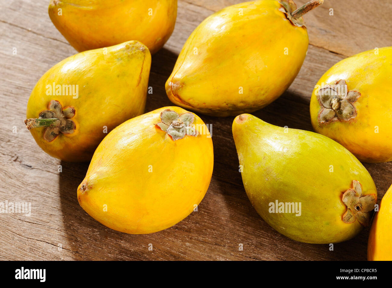 Chinese plum on wooden background Stock Photo