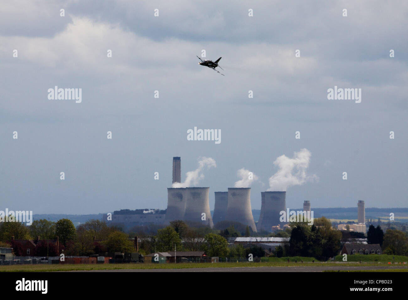 A RAF Hawk Flying over Didcot  Power Station  a natural-gas power plant England Stock Photo