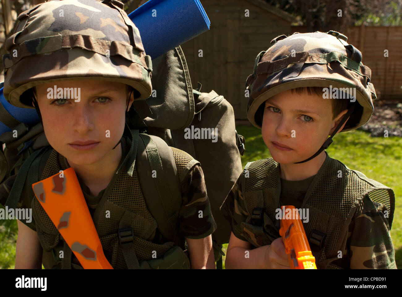 Young boys playing soldiers Stock Photo