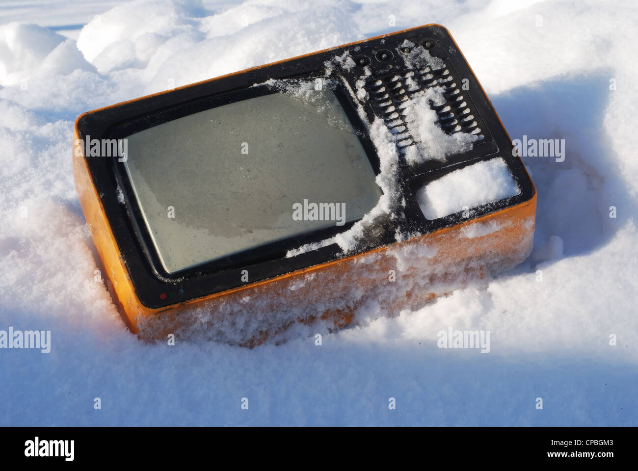 old broken television set on the snow Stock Photo