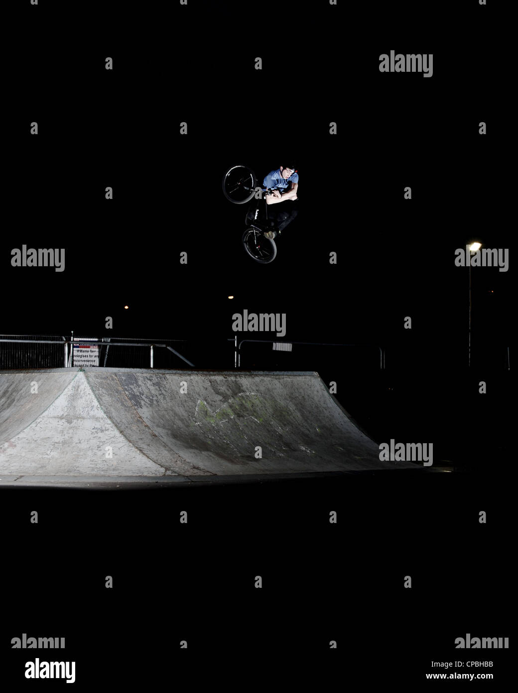 BMX rider performs tricks at an indoor skatepark Stock Photo Alamy