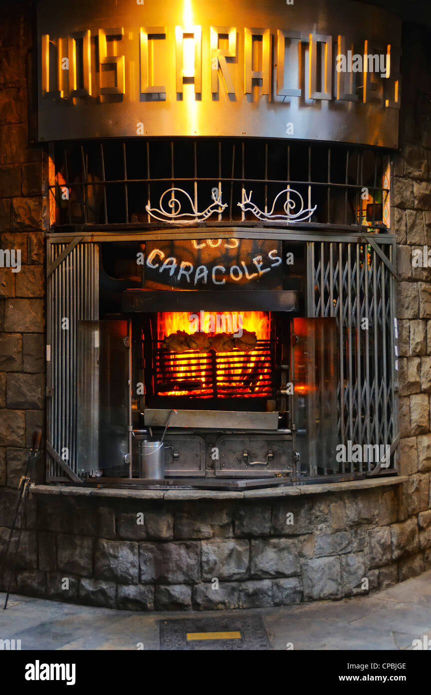 Outdoor grill at the Caracoles restaurant located in the Barri Gotic (Gothic quarter), Barcelona, Spain. Stock Photo