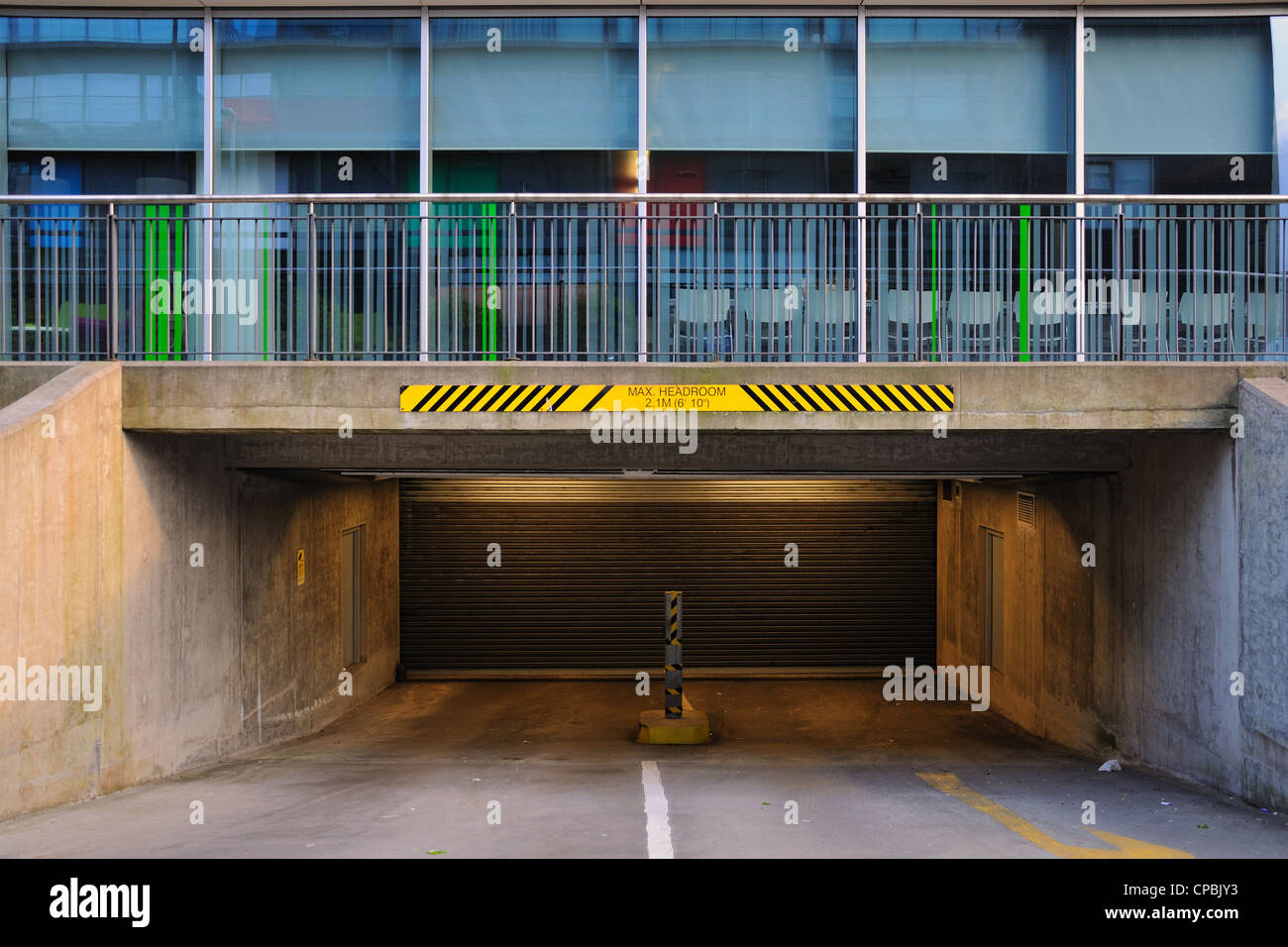 Underground car park serving offices in Glasgow city centre, with max height restriction warning sign. Scotland, UK. Stock Photo