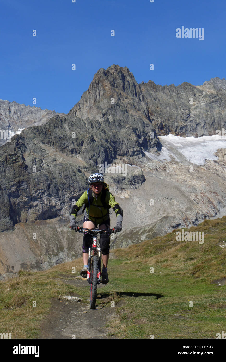A lady mountain biker in the French Alps Stock Photo