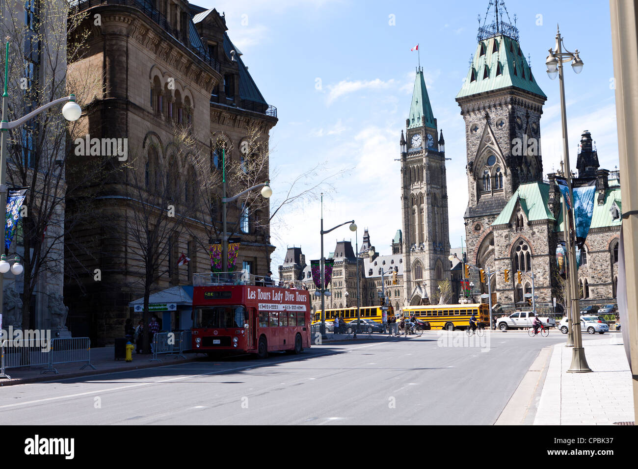 Ottawa downtown, red double-decker bus in front of Parliament Hill Stock Photo