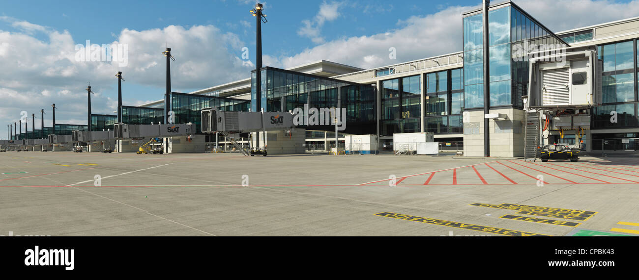 Panorama of  New Berlin-Brandenburg Airport gates made from high resolution digital Hasselblad shots. Sunny day with clouds. Stock Photo