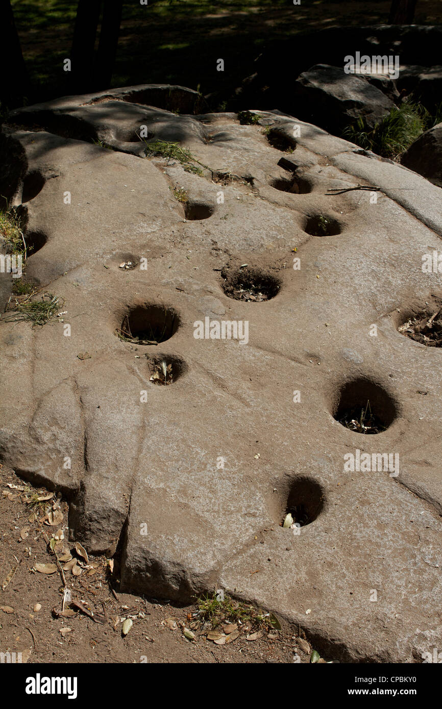 Native American Indian acorn grinding holes mortar stones in bedrock Stock Photo Alamy