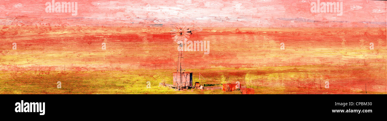 Stitched Panorama Landscape red arid look with wind pump in foreground Stock Photo