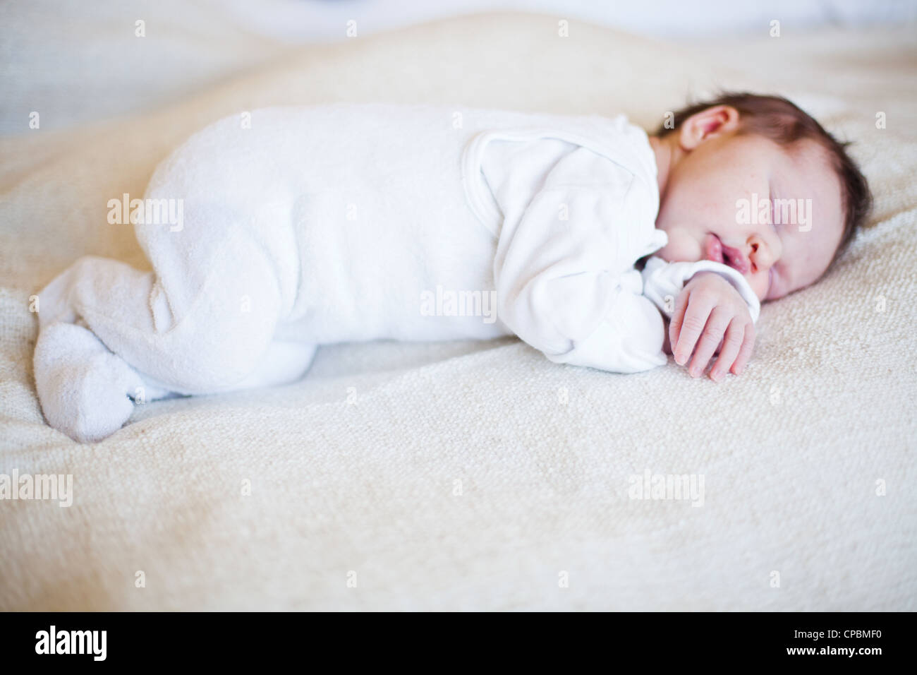 Portrait of a cute newborn baby girl sleeping Stock Photo - Alamy
