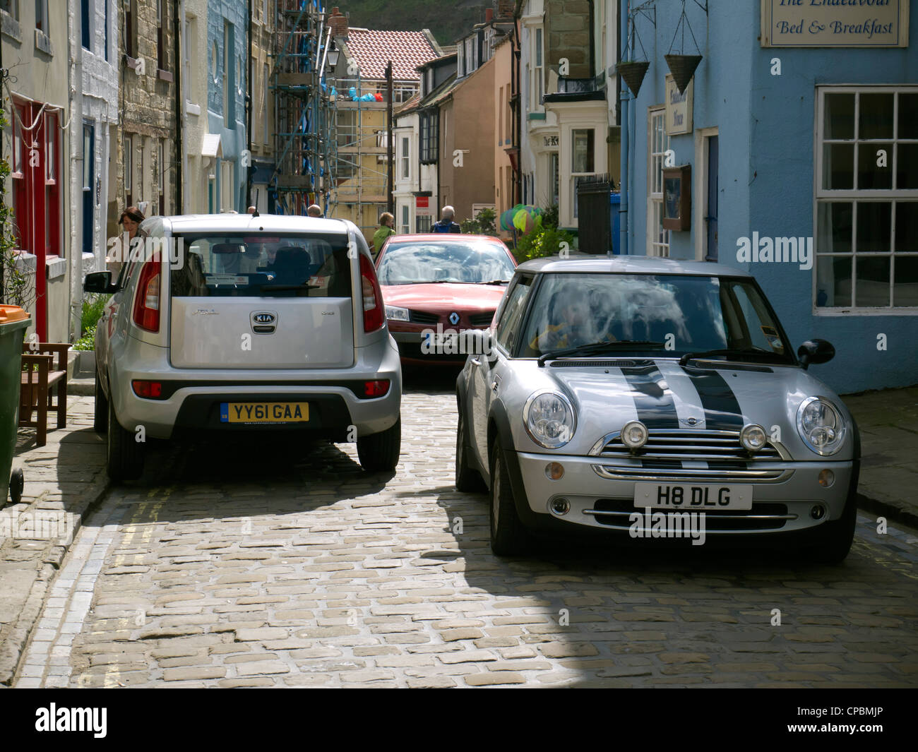 Traffic congestion in Staithes High Street from visitors cars ignoring the “Permit Holders Only” entry restrictions Stock Photo