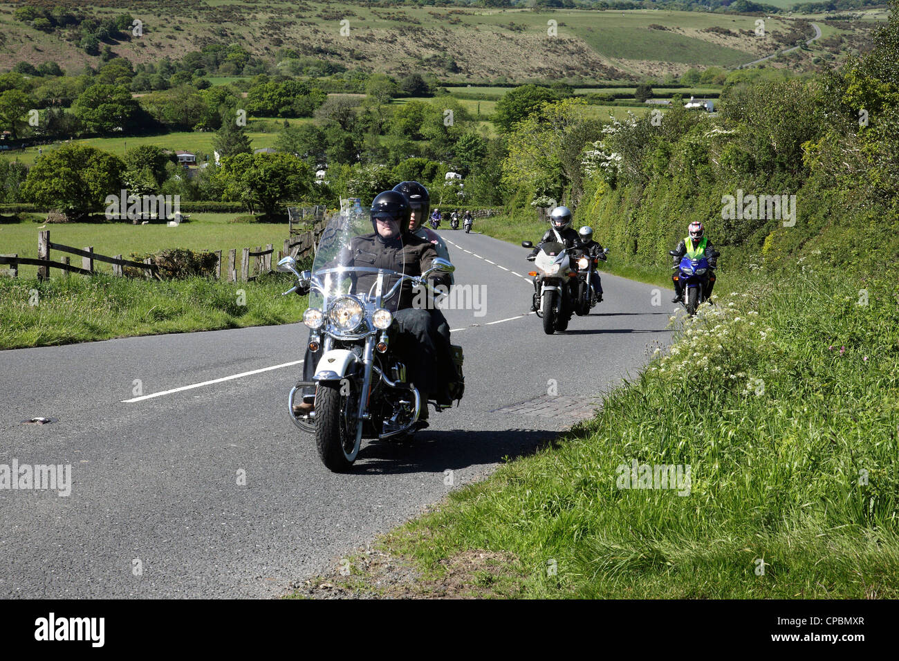 A group of motorcyclists enjoy a scenic ride over Dartmoor, UK , raising money for charity at the same time. Stock Photo