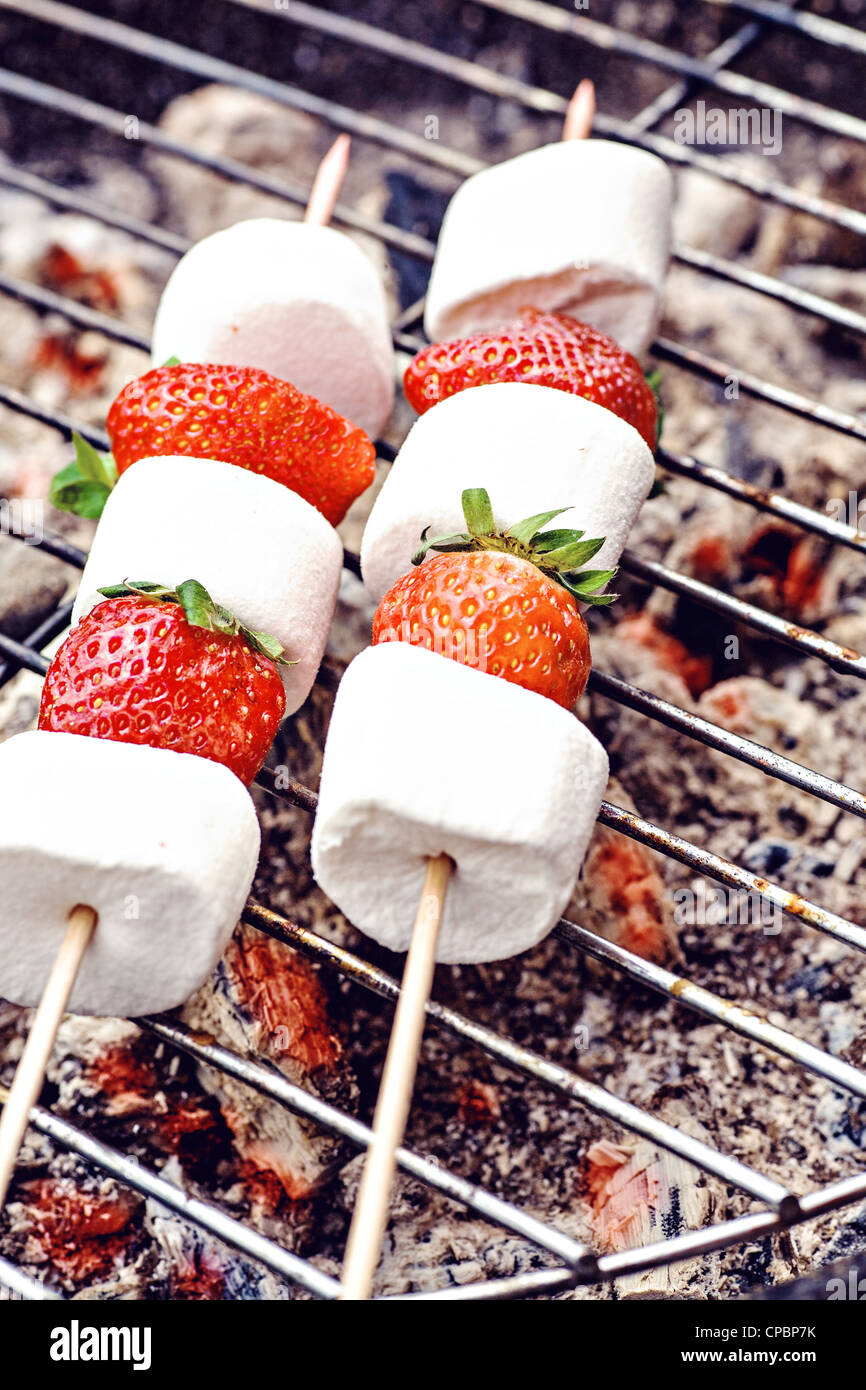 close up shut of marshmallows and stawberries on the grill Stock Photo -  Alamy