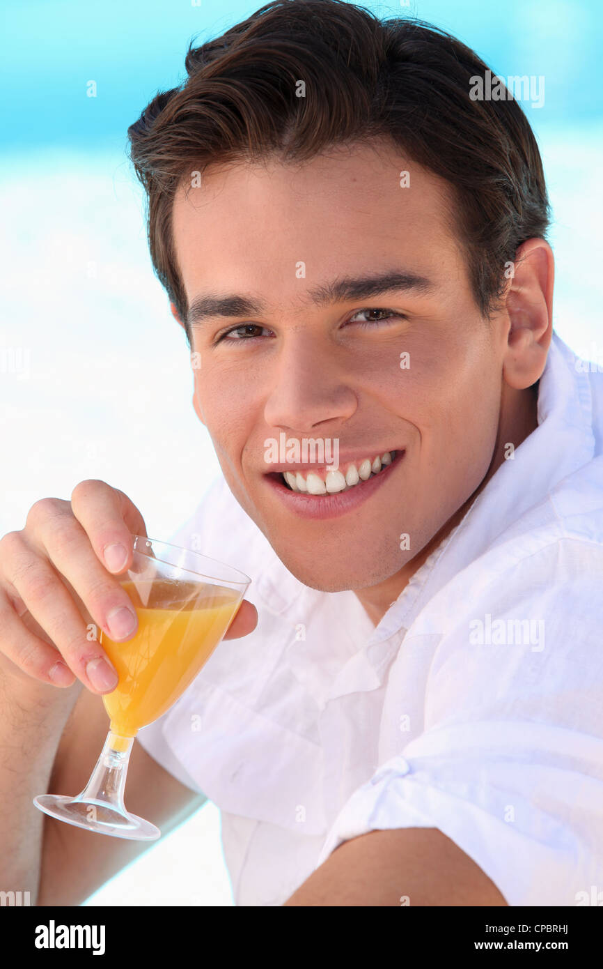 Young Man Drinking Orange Juice Stock Photo Alamy young-man-drinking-orange-juice-stock-photo-alamy