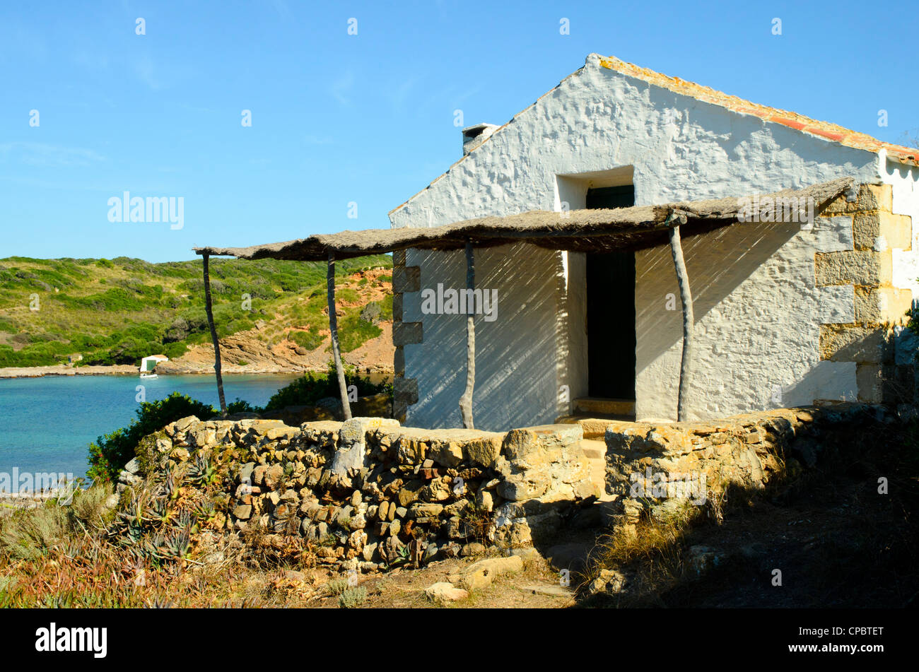 House at Cala de sa Torreta on the coast of Menorca in the Balearic islands, Spain Stock Photo