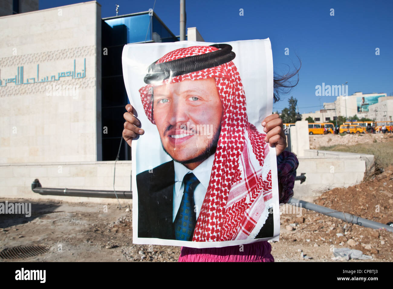 A young supporter of the king Abdullah II at the Army Day celebrations in Amman, Jordan. Stock Photo