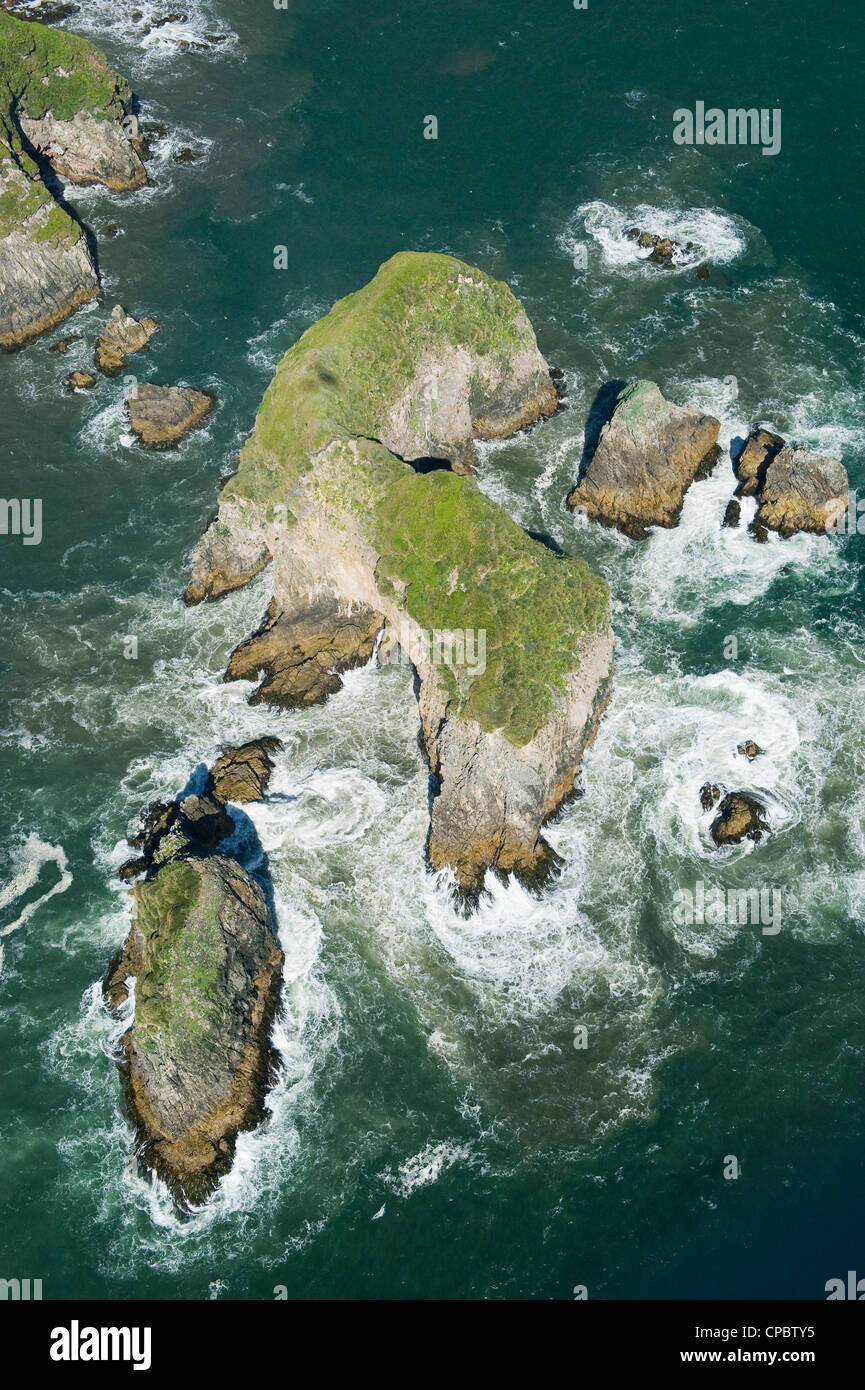 Aerial of offshore rocks, Pacific Coast, Chiloe Island, CHILE : Habitat for endangered Marine Otter (Lontra felina) Stock Photo