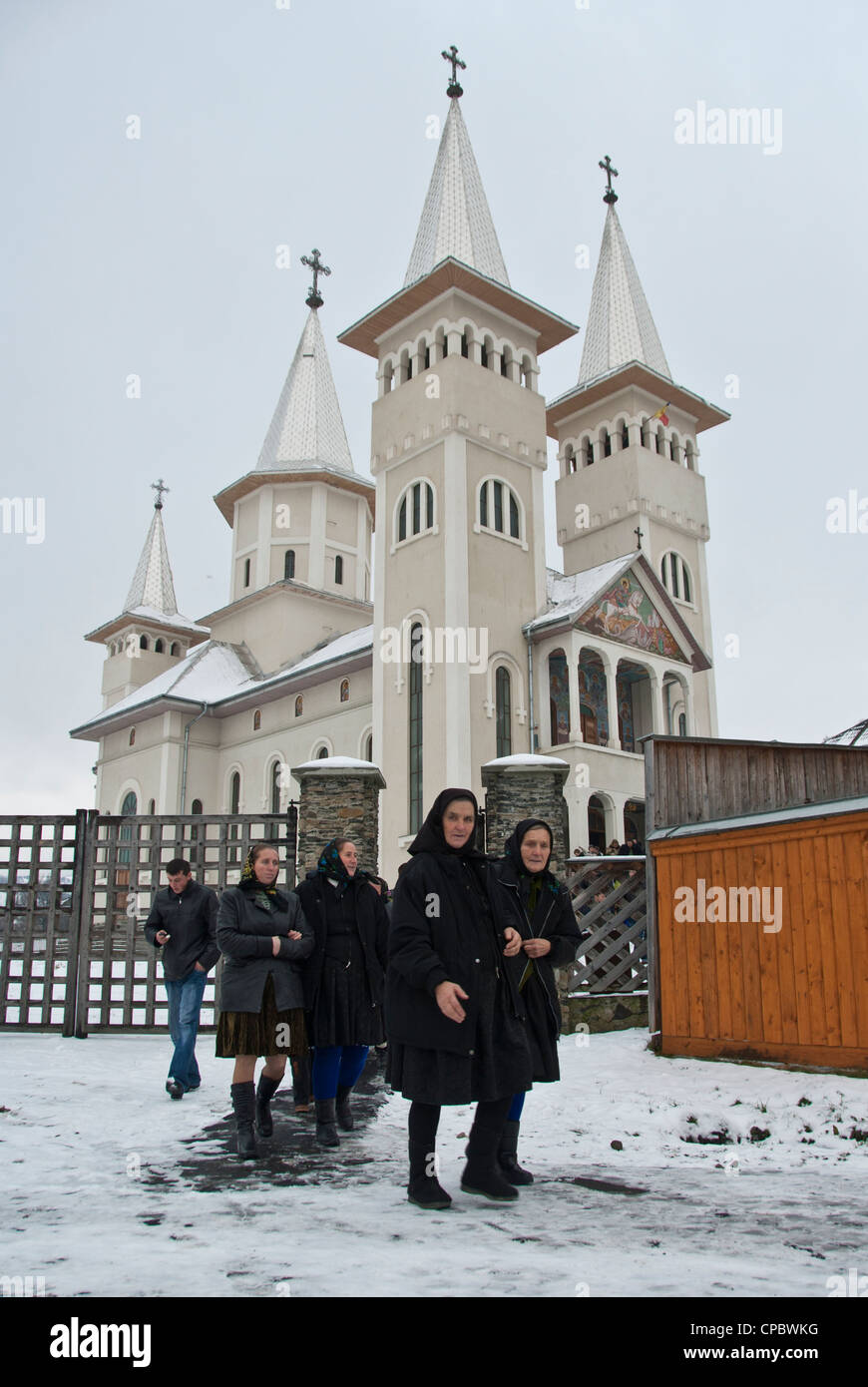Local women coming out of the Church, Maramures, Romania Stock Photo