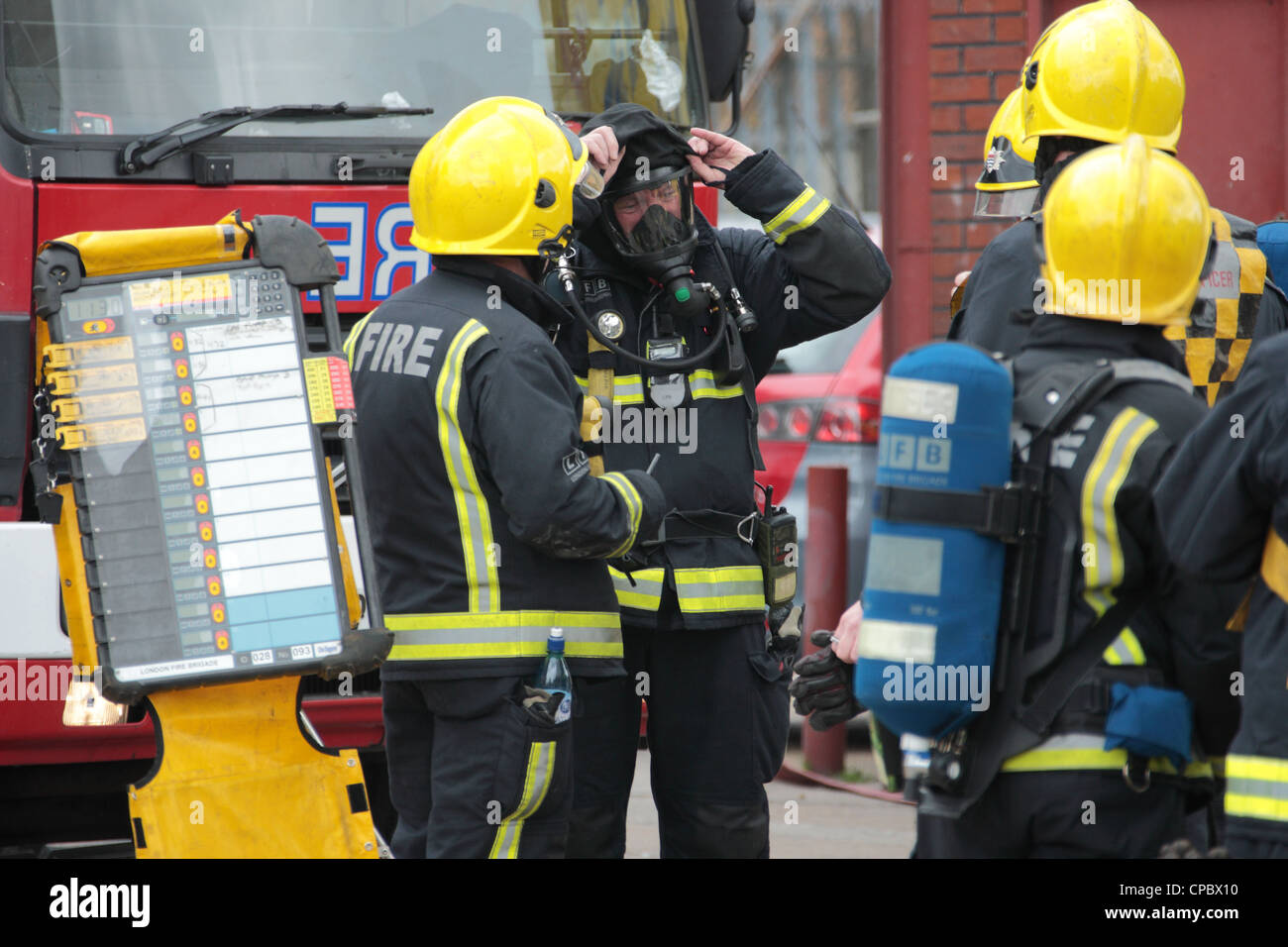 London Fire Brigade Firefighters At BA Control Point During A Fire In ...