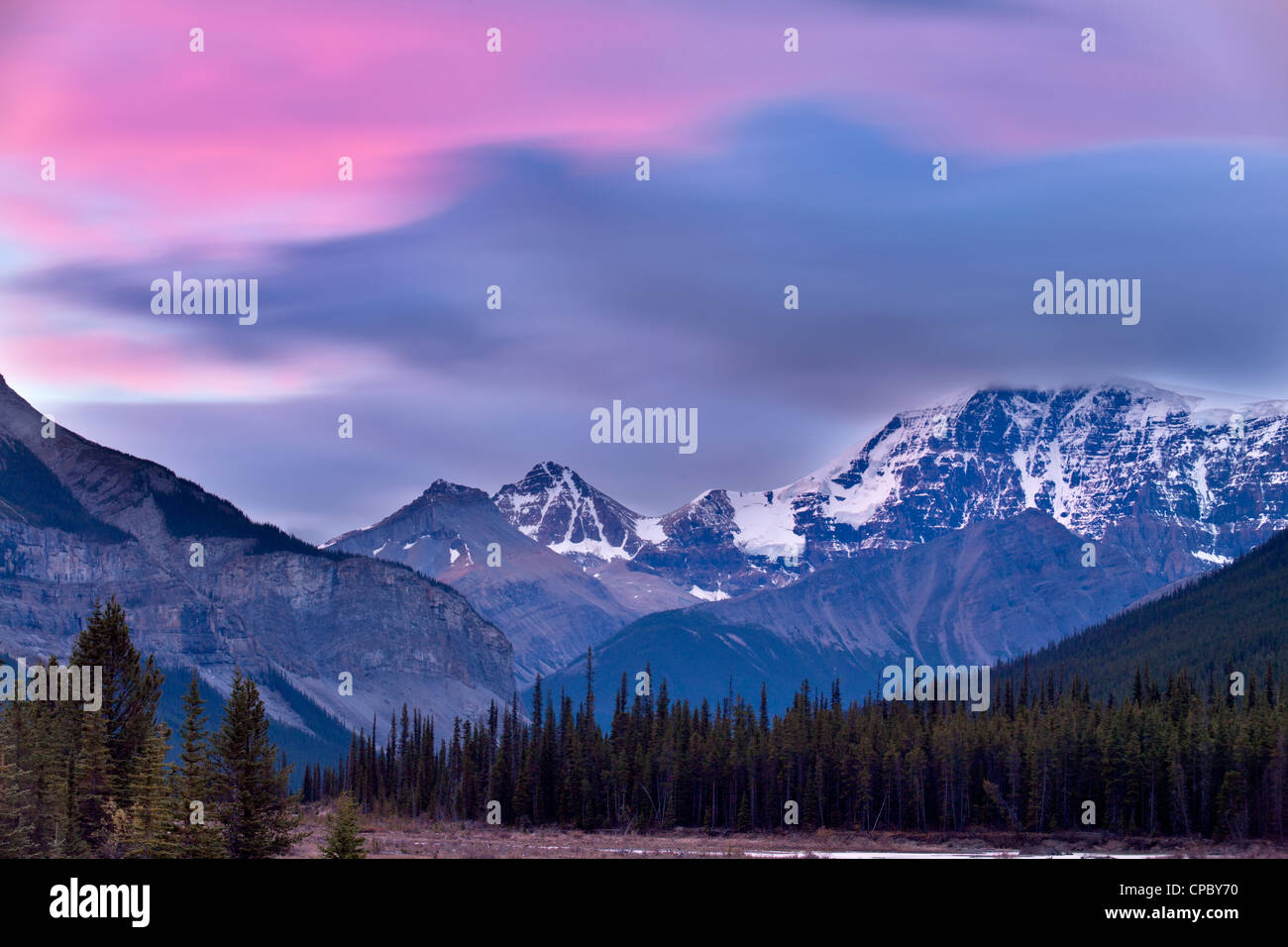 Alpenglow on clouds over Mount Kitchener and Beauty Creek-Jasper National Park, Alberta, Canada. Stock Photo